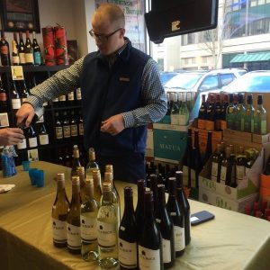 Man pouring wine samples